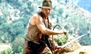 Harrison Ford som Indiana Jones, redo för äventyr i en djungel. En ikonisk scen från filmer med Harrison Ford.